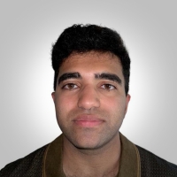 a profile headshot of Arjun Nair