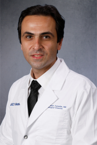 Anderanik Tomasian headshot with gray background