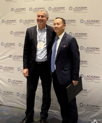 Shawn (Liangzhong) Xiang (standing to the right of Department of Radiological Sciences Chair Vahid Yaghmai) receives the Distinguished Investigator Award from the Academy for Radiology Biomedical Imaging Research