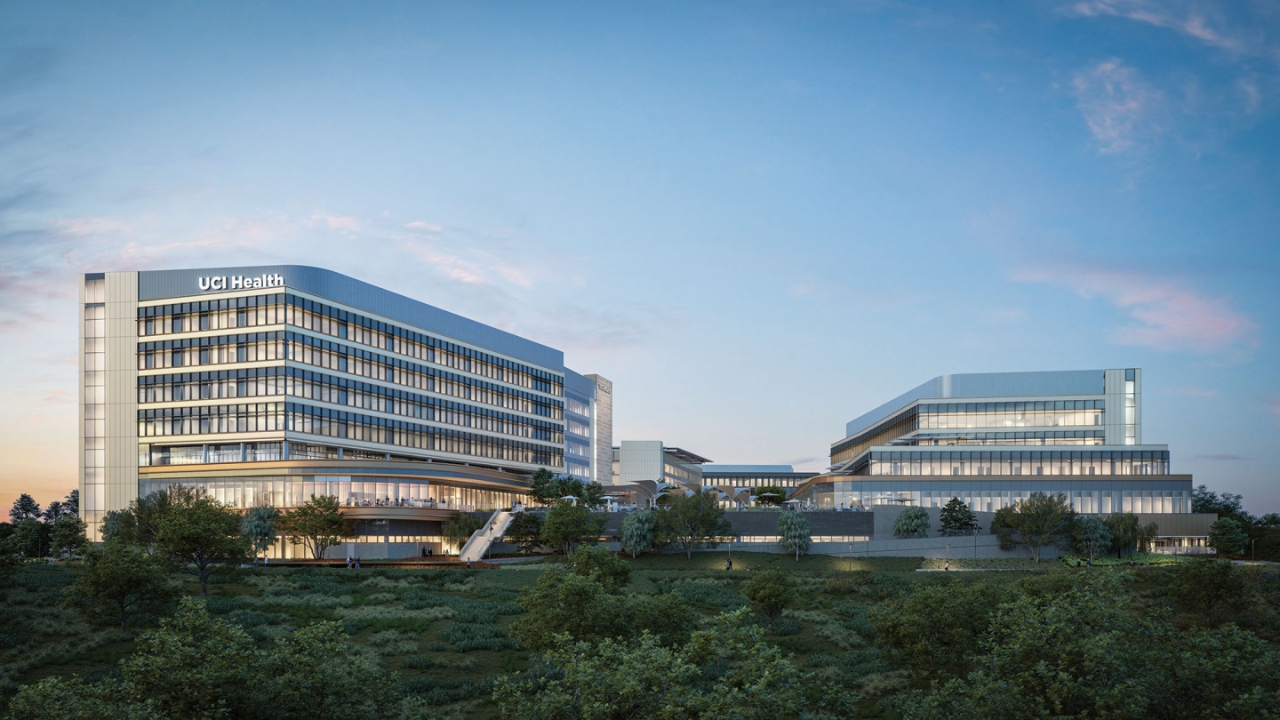 UC Irvine Medical Center — Irvine Facility — Modern healthcare facility with glass windows and labeled “UCI Health” against an evening sky.