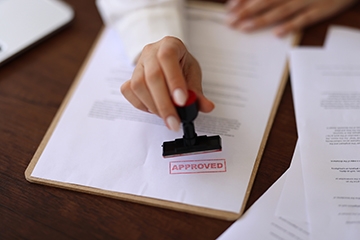 stamp of approval on paper