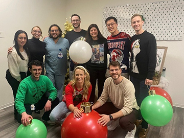 ENT residents dressed in holiday sweaters