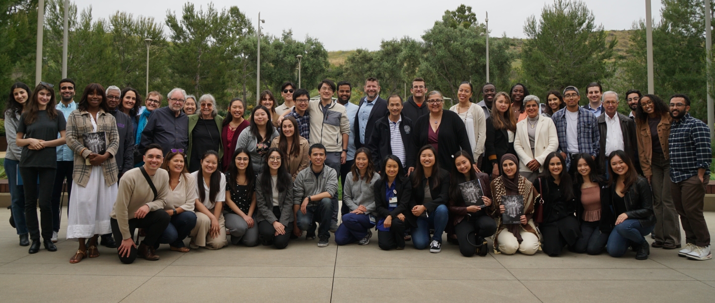A large group of people together in a courtyard.
