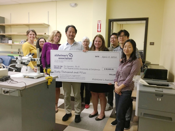 Dr. Igarashi lab receiving a donation from Alzheimer's Association