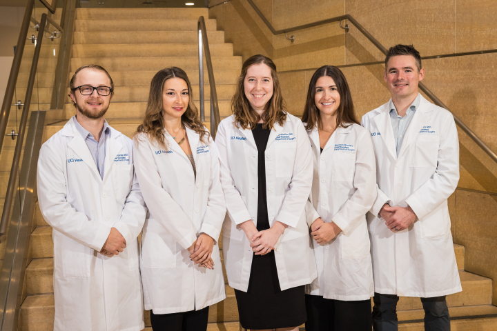 Chief residents in white lab coat posing in front of stairs — from left to right: Robert Painter, Francesca Kimelman, Alice Martino, Shannon Skochko, Bernard "Ben" Morris
