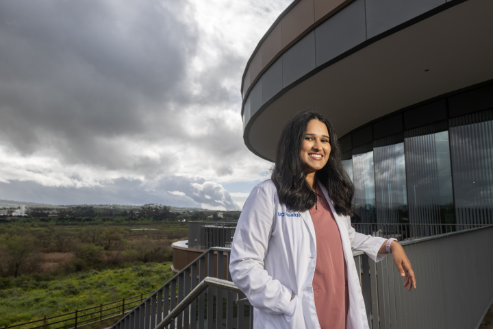 Sabrina Mir stands near the new UCI Health – Irvine hospital, with the marsh in the background.