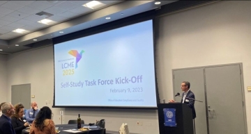 Dean Stamos at podium next to a presentation slide that reads LCME 2025 Self-Study Task Force Kick-Off