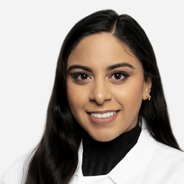 Headshot of Priti Chamdal in whitecoat