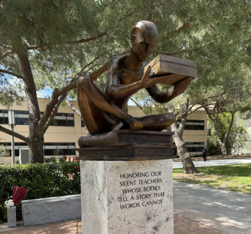 The donor statue, called the "The Gift," sitting above a pedestal that reads: Honoring Our Silent Teachers Whose Bodies Tell A Story That Words Cannot