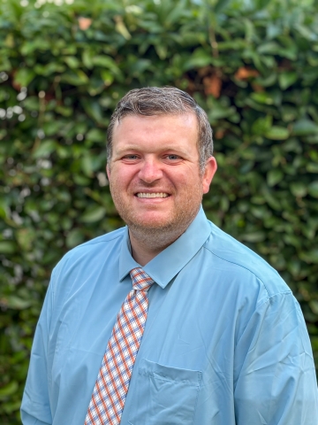 Professional headshot of Tyson Burnham, MD