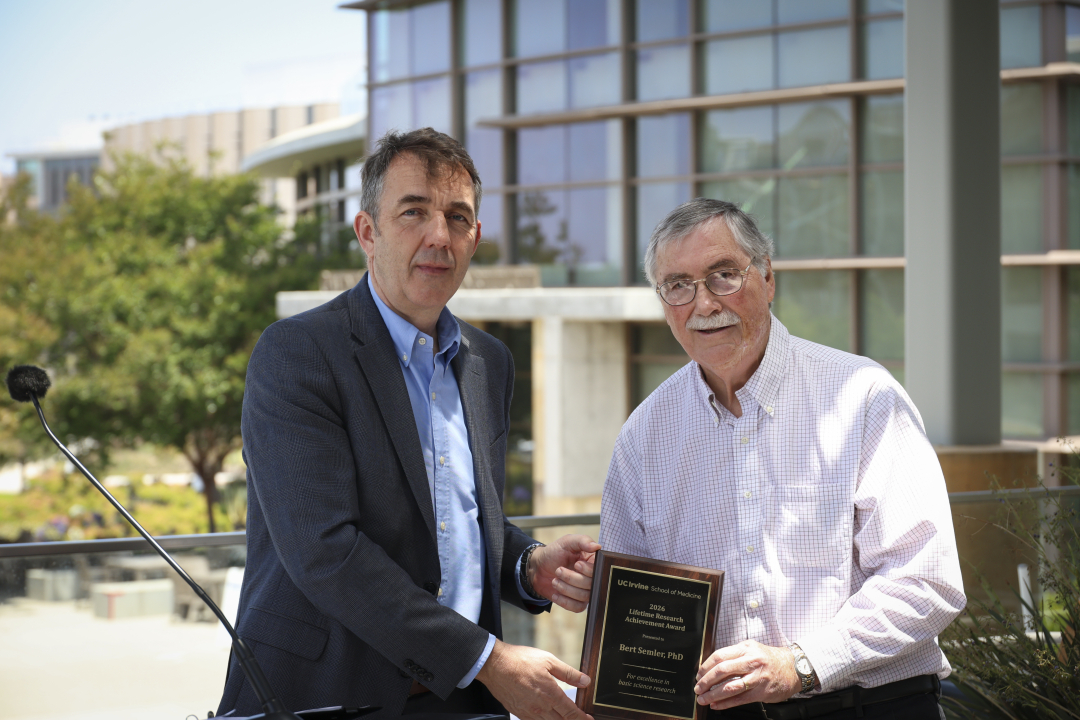 Abbott handing Semler his award.